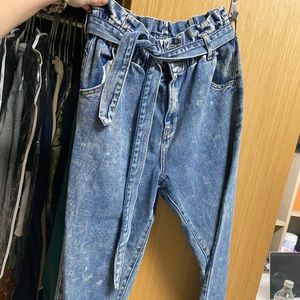 Pac-sun size 27 wrap tie jeans. Very stretchy and paper bag style waist